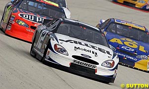 2002 NASCAR Winston Cup Rookie of the Year Ryan Newman holds off Jeff Gordon and Jeff Green on his way to sixth place in the race and standings
