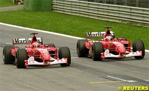 Schumacher overtakes Barrichello on the line