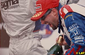 Michael Andretti gets drowned in champagne