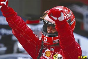 Michael Schumacher celebrates his win