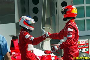 Barrichello and Schumacher after the race