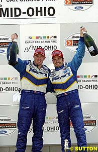 Player's/Forsythe teammates Paul Tracy and Patrick Carpentier celebrate their 1-2 finish at Mid-Ohio
