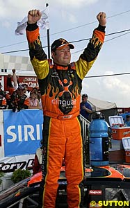 Robby Gordon celebrates after sweeping the NASCAR road course events
