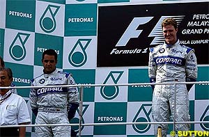 Montoya and Ralf on the podium in Malaysia, 2002