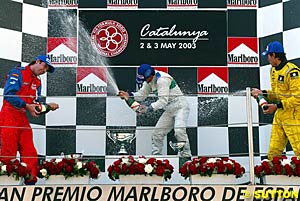 Winner Giorgio Pantano lets fly with the champagne spray on the podium
