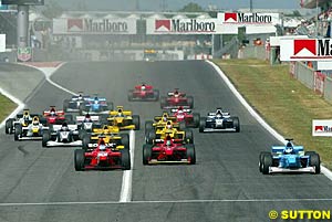 Giorgio Pantano leads the field into turn one at the start of the race