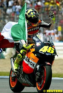 Valentino Rossi celebrates his victory in Spain on his cooldown lap