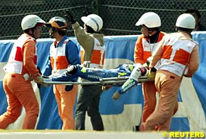 Daijiro Kato being taken away from the accident scene on a stretcher