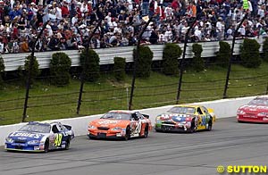 Jimmie Johnson leads Tony Stewart, Elliott Sadler and Dale Earnhardt Jr early in the race