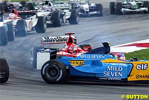 Schumacher crashes into Trulli in Malaysia