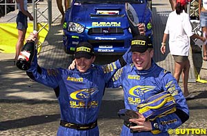 Petter Solberg and Phil Mills celebrate in Cyprus