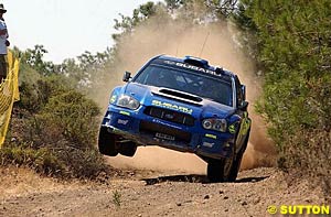Petter Solberg charges through the gravel in Cyprus