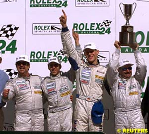 The winning Racers Group drivers celebrate their Rolex 24 At Daytona victory