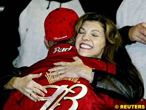 Teresa Earnhardt hugs stepson Dale Earnhardt Jr after his victory in the Bud Shootout