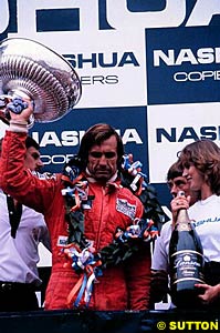 Carlos Reutemann on the podium as the winner of the South African GP, 1981. This race was later declared outside the championship