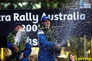 Timo Rautiainen and Marcus Gronholm celebrate victory at last year's Rally Australia, something they may not be able to do in 2003