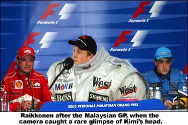Raikkonen after the Malaysian GP, when the camera caught a rare glimpse of Kimi's head