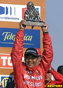 Car winner Hiroshi Masuoka celebrates his second Dakar win
