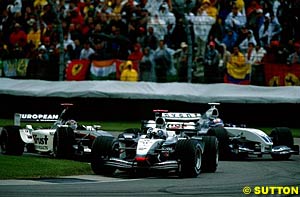 Coulthard passes a struggling Montoya at Suzuka