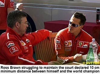 Ross Brawn struggling to maintain the court declared 10 cm minimum distance between himself and the world champion