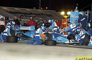 Paul Tracy makes a pit stop under the lights
