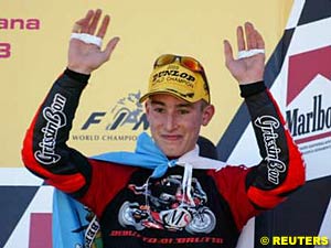 250cc World Champion Manuel Poggiali on the podium at Valencia