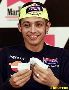 Valentino Rossi speaks at a press conference after the race at Valencia