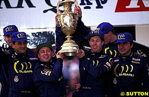 The 1995 Rally GB podium, which saw Carlos Sainz, Colin McRae, Richard Burns and Carlos Sainz as teammates celebrate Subaru's manufacturer's title