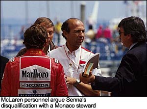McLaren personnel argue Senna's disqualification with a Monaco steward