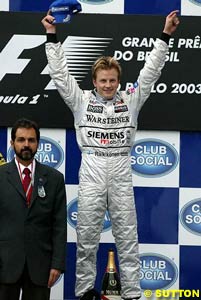 Raikkonen stands on top of the podium in Brazil