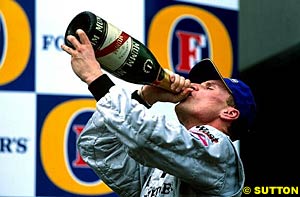 Coulthard celebrates his only win of the season
