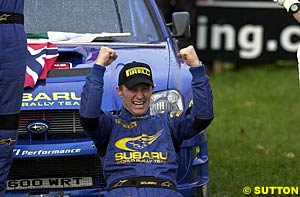 Petter Solberg celebrates after the end of the final stage