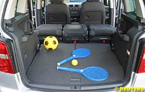 The three middle-row seats of the VW Touran slide individually backwards and forwards with ease, and the centre seat can be removed to allow the two outer seats to be moved inwards. 