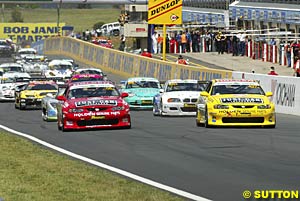 The start of the race, the two Monaros on the front row already showing the way