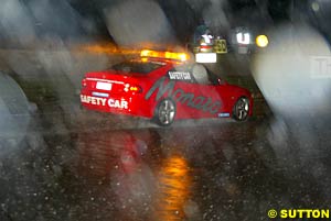 Rain fell hard during the night as well as during the day, the safety car wading its way through the deluge