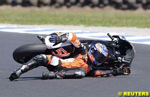 250cc rider Chas Davies crashes during practice at the Australian Grand Prix