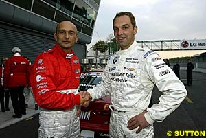 2003 European Touring Car Champion Gabriele Tarquini, left, and runner-up Jorg Muller, right