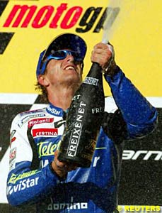 Sete Gibernau sprays the champagne on the podium