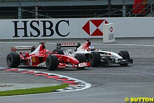 Schumacher passes Button for the lead