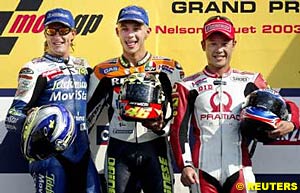 Second place finisher Sete Gibernau, winner Valentino Rossi and third place finisher Makoto Tamada stand on the podium in Brazil