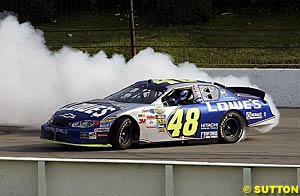 Winner Jimmie Johnson smokes 'em up after his win
