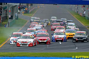 Jason Bright leads the field at the start of race three