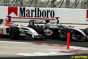 Sato overtakes Coulthard