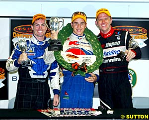 Second placed Craig Lowndes, winner Rick Kelly and third placed Garth Tander celebrate inside in dryness