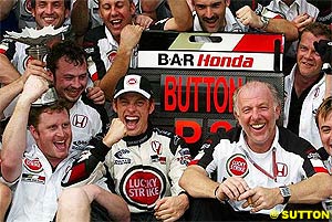 Button celebrates his first podium