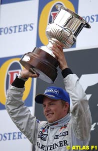 Kimi Raikkonen celebrates winning the 2004 Belgian Grand Prix