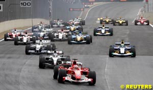 Rubens Barrichello leads into Turn 1