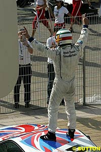 2004 European Touring Car Champion Andy Priaulx celebrates his title win