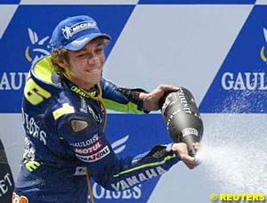 Winner Valentino Rossi celebrates on the podium