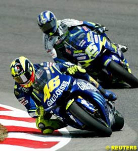 Valentino Rossi leads Sete Gibernau in a race-long battle between the two riders